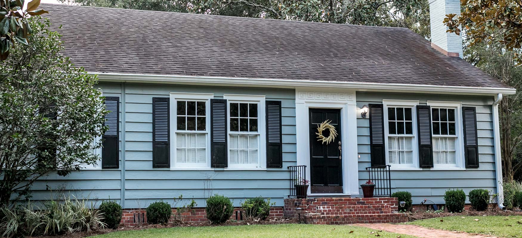 Blue House With Shutters Photo